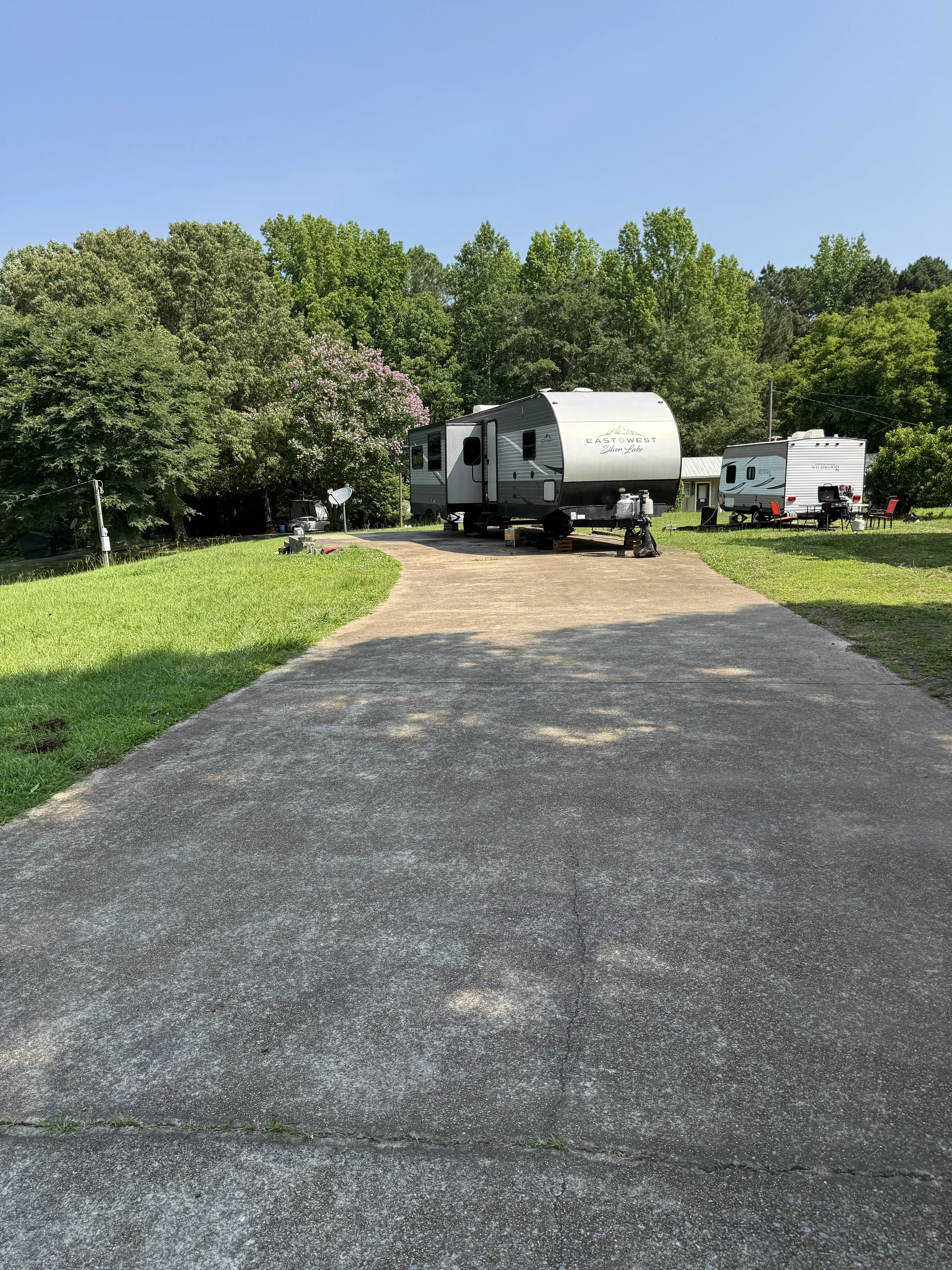 Concrete paved lot with RV parked